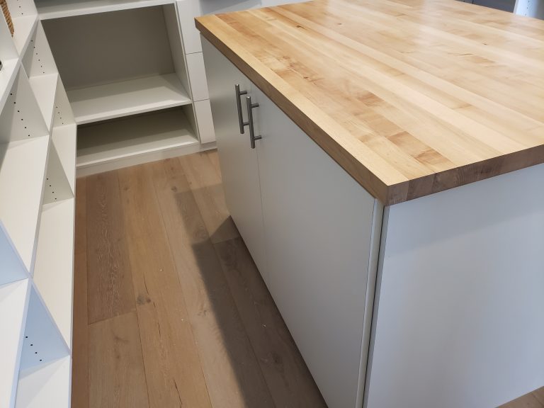 Pantry and laundry cabinets with folding counter by Triton